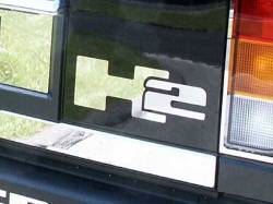 Quality Automotive Accessories - QAA HV43026 2Pc Stainless Steel Graphic/Logo/Emblem for 2003-2009 Hummer H2 - Image 1